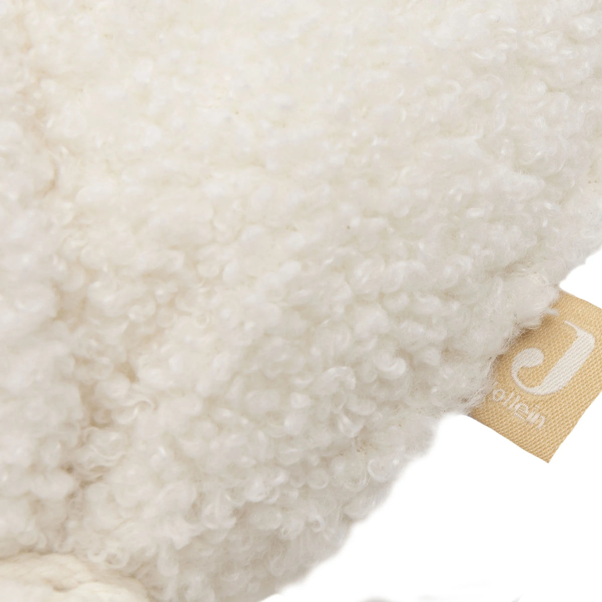 Detail van de zachte bouclé met het Jollein-label, ballon Teddy Bear